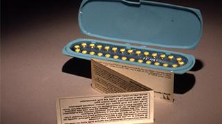 A set of oral contraceptive pills (circa 1970) and the first patient package insert from the Food and Drug Administration. 